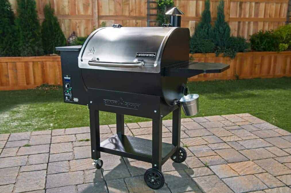a camp chef woodwind classic pellet grill on a paved pa.