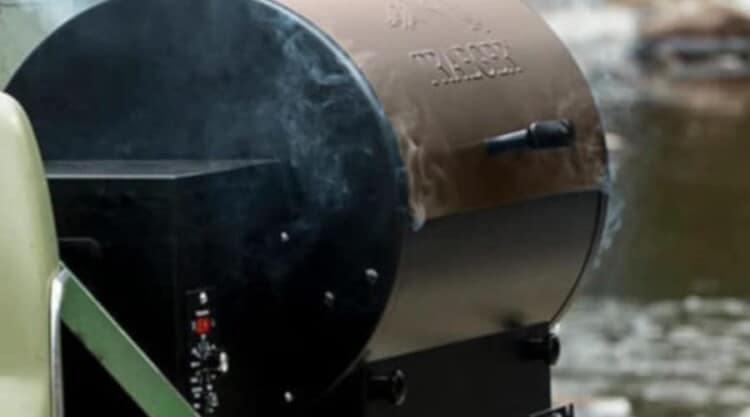 a Traeger pellet grill, smoking away on a tailgate.