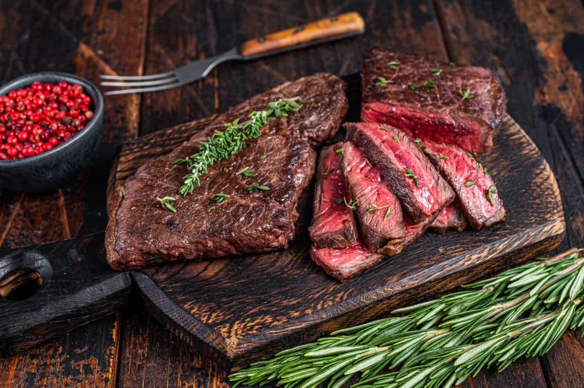 grilled and sliced skirt steak with some thyme and rosem.