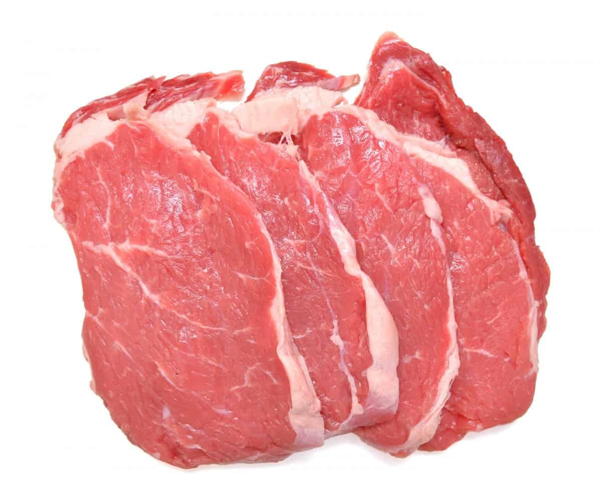 raw shoulder steaks isolated on white