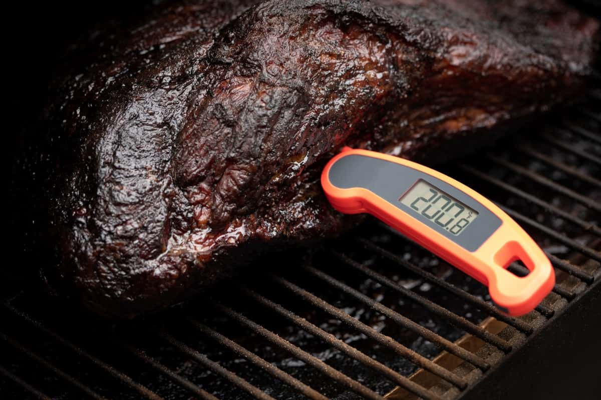 An instant read thermometer in brisket reading 20.
