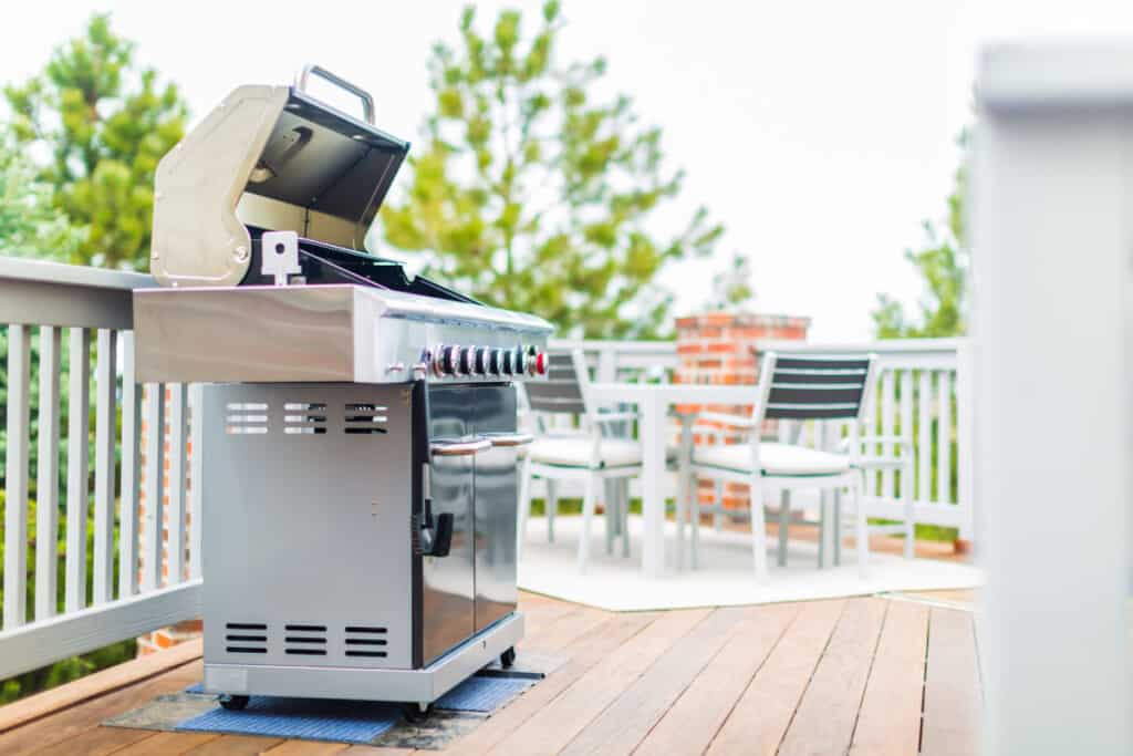 An infrared grill shot, from the side with garden furniture in the backgro.