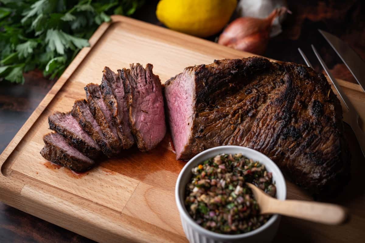 roasted tri-tip with bowl of chimichurri sa.