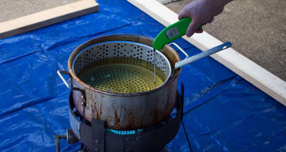 The temp of a deep fat fryer being ta.