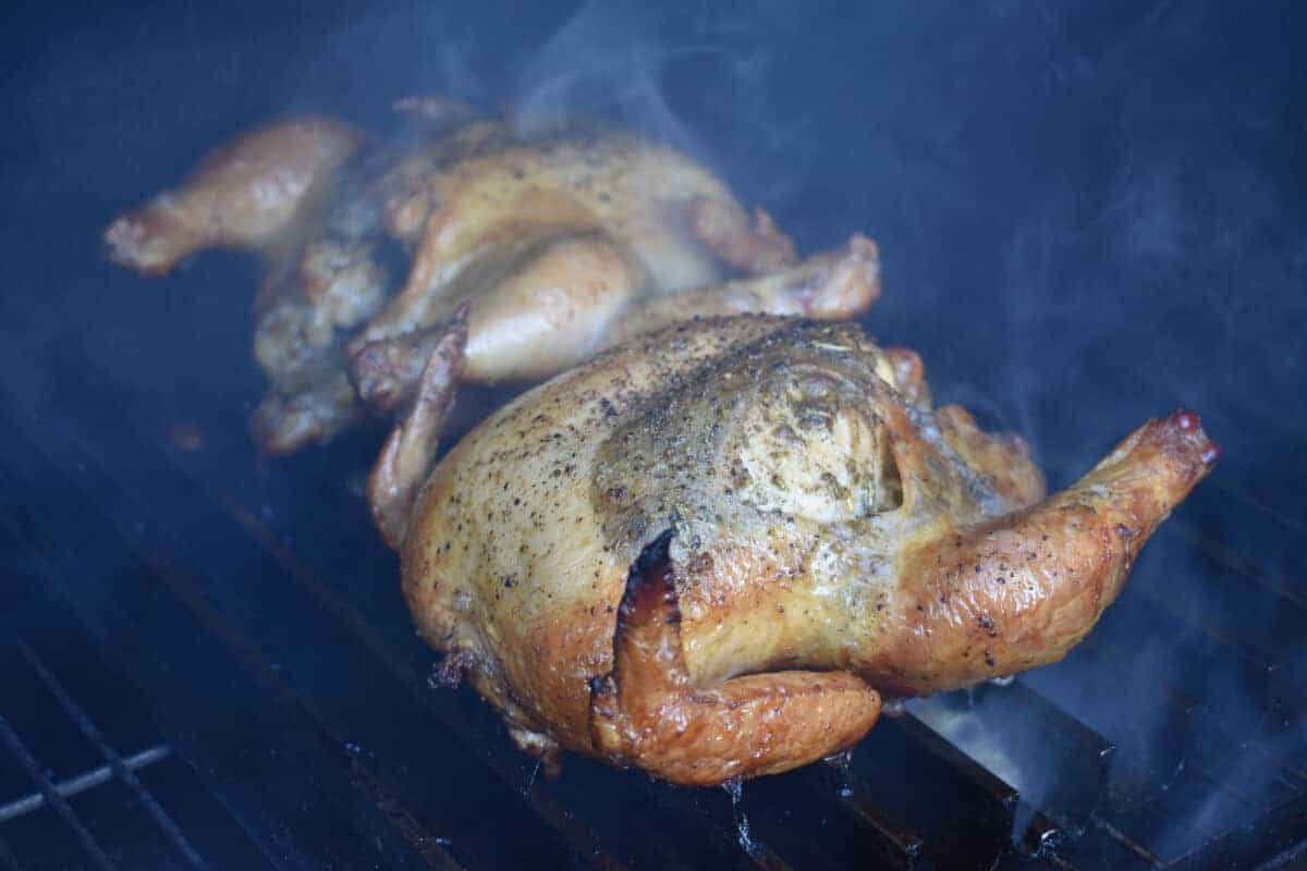 Three Cornish hens in a barbecue smoker