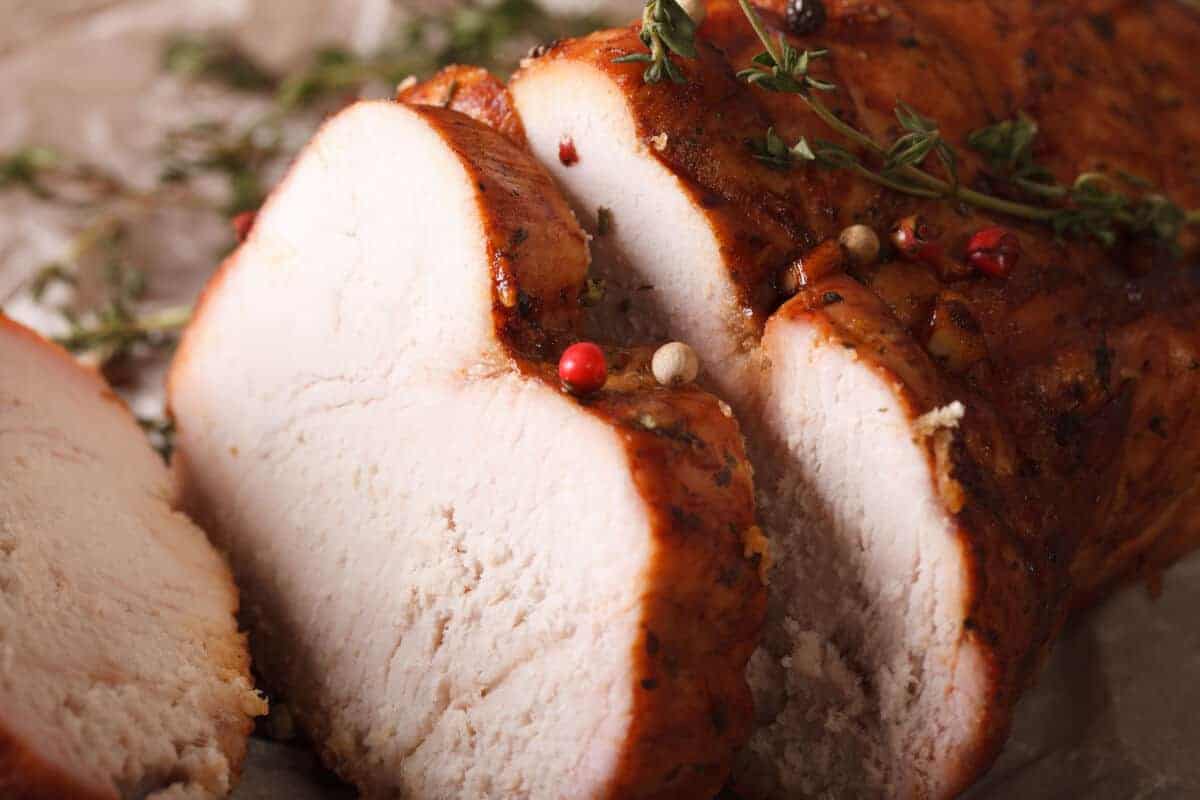 Close up of a smoked and sliced turkey breast