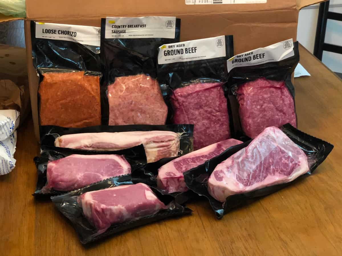 A selection of porter road meats laid out on a ta.