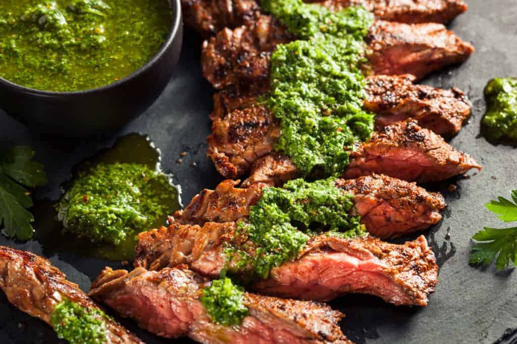 skirt steak, sliced, drizzled with a chimichurri sa.