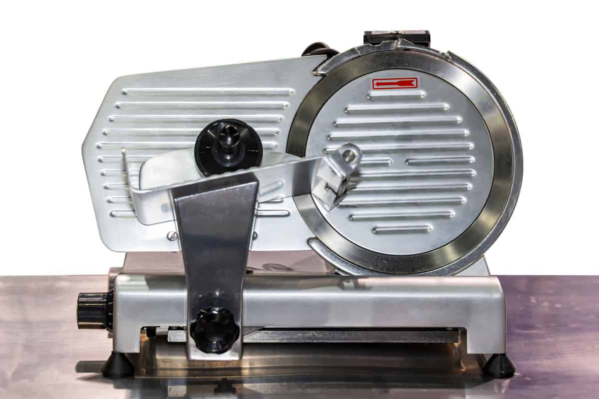 Front view of a commercial grade semi-automatic electric meat sli.