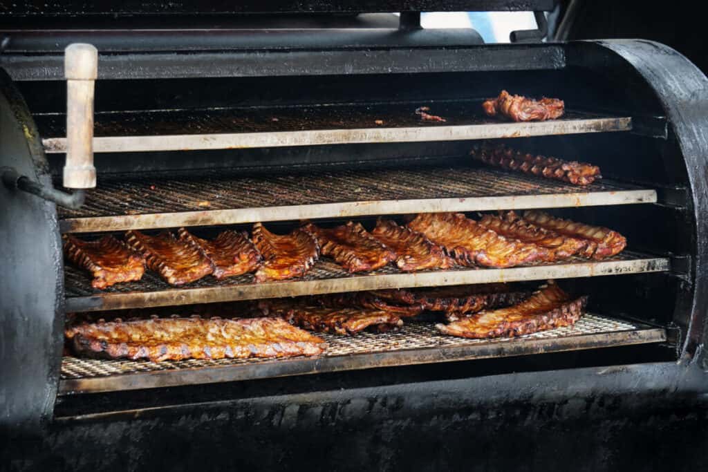 pork ribs in a BBQ smoker