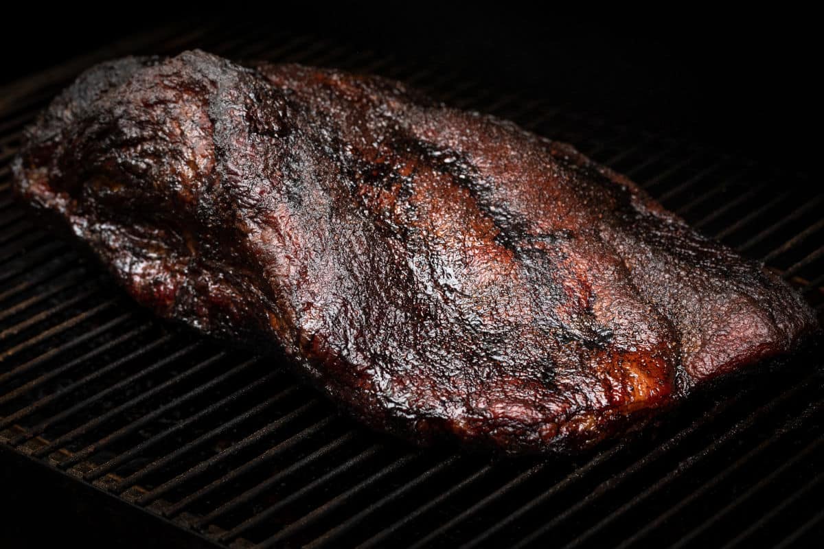 Brisket smoking on a grill