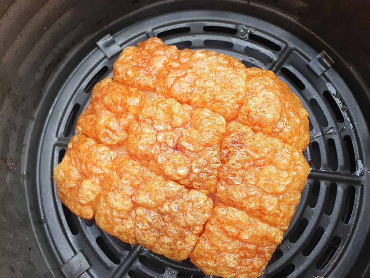 A top down view of some amazing pork crackling in a fr.