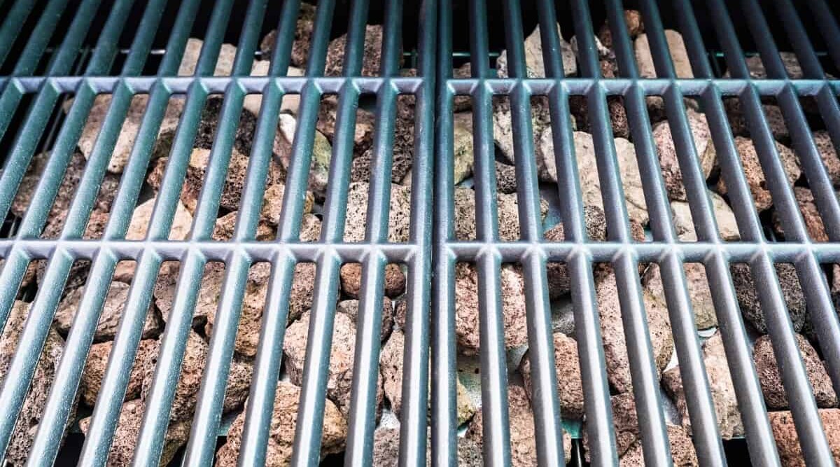 lava rocks in gas grill, under a chrome or SS grate.