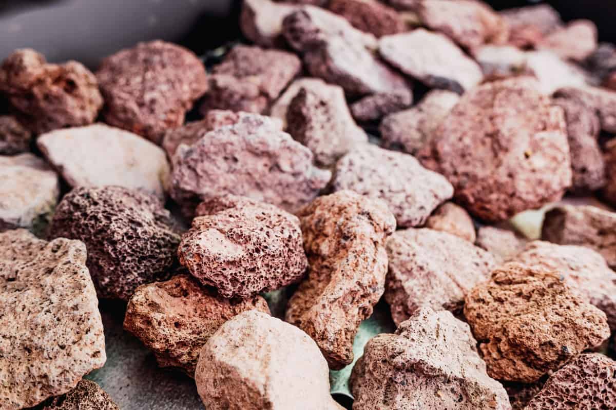 Close up of beige and brown lava rocks meant for use in gri.