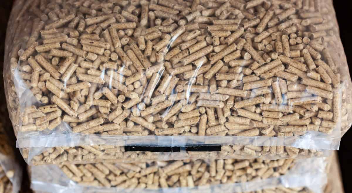 A short pile of wood pellets in b.