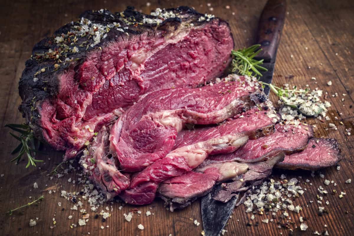 A blue rare kobe ribeye joint grilled blue and sliced thinly