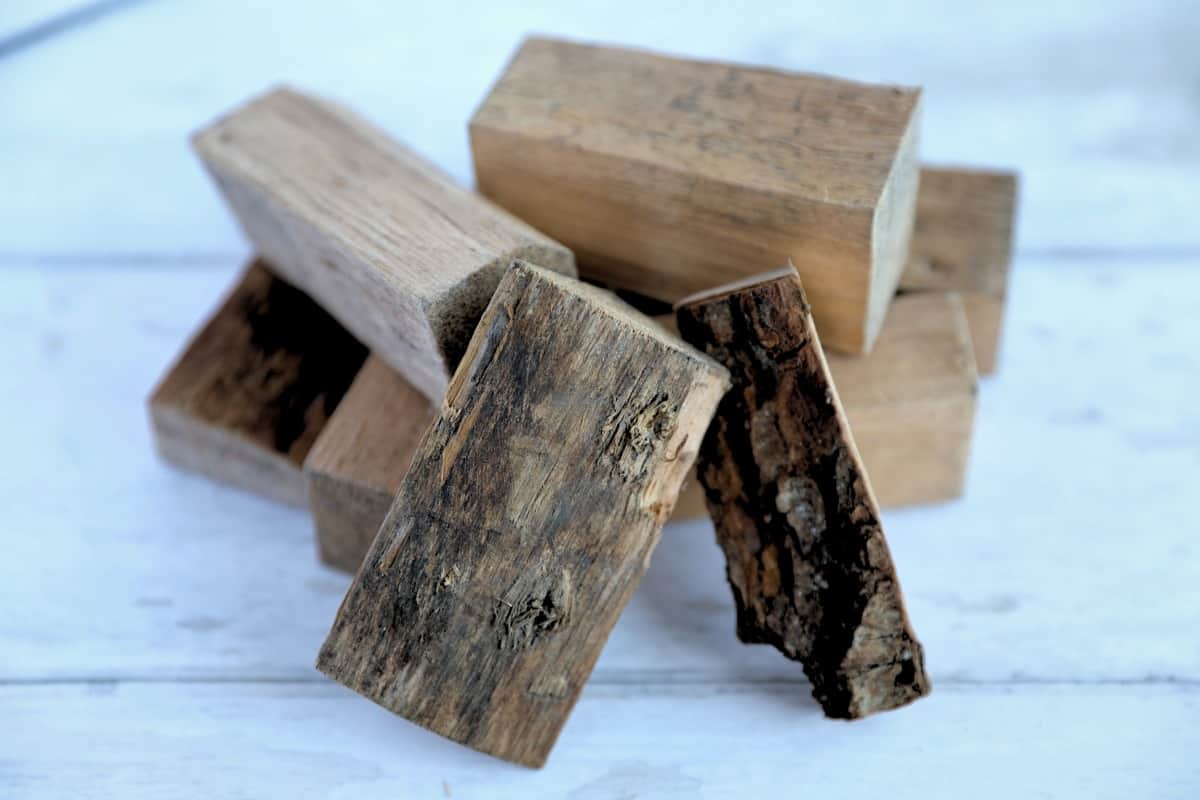 Chunks of alder wood on an off white blurred background.