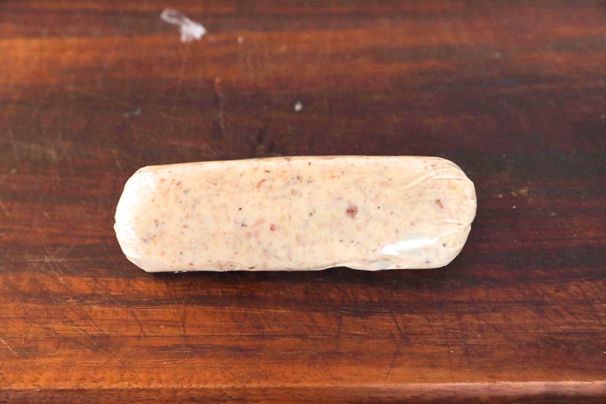 A cling film wrapped bone marrow butter .