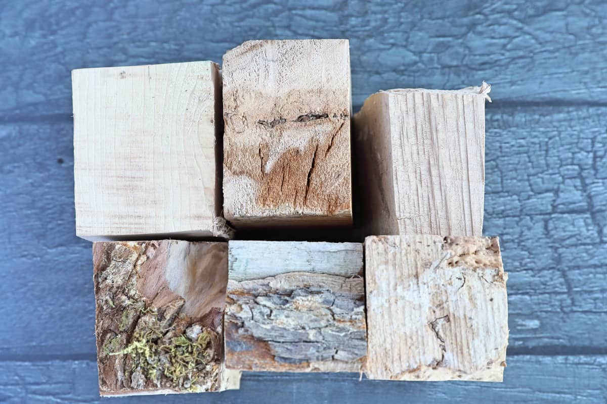 Maple wood chunks on a dark colored wooden table