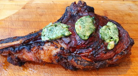 Wild garlic and bone marrow butter melted onto a grilled ribeye steak.