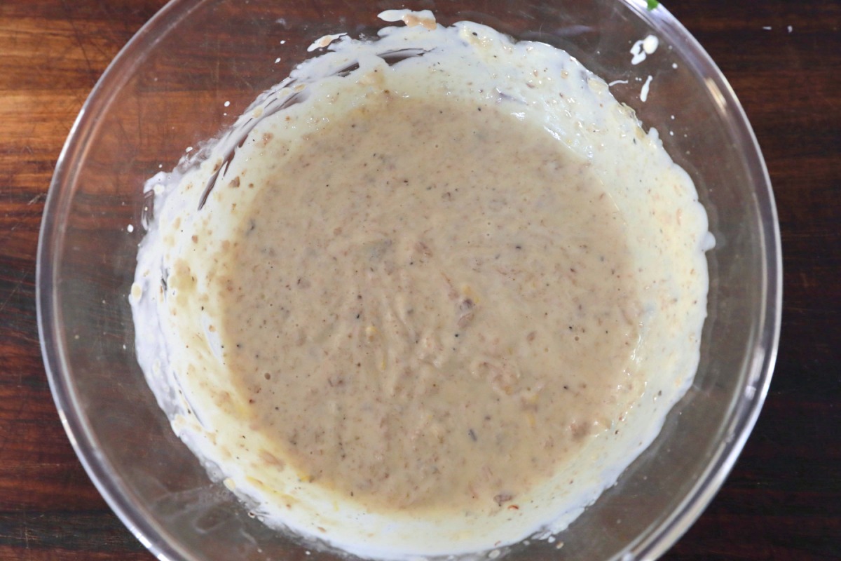 All the ingredients for bone marrow butter in a bowl and well mi.