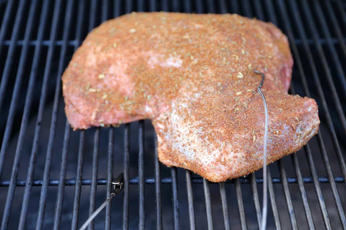 UltraQ probes attached to grate and inserted into meat for monitor.