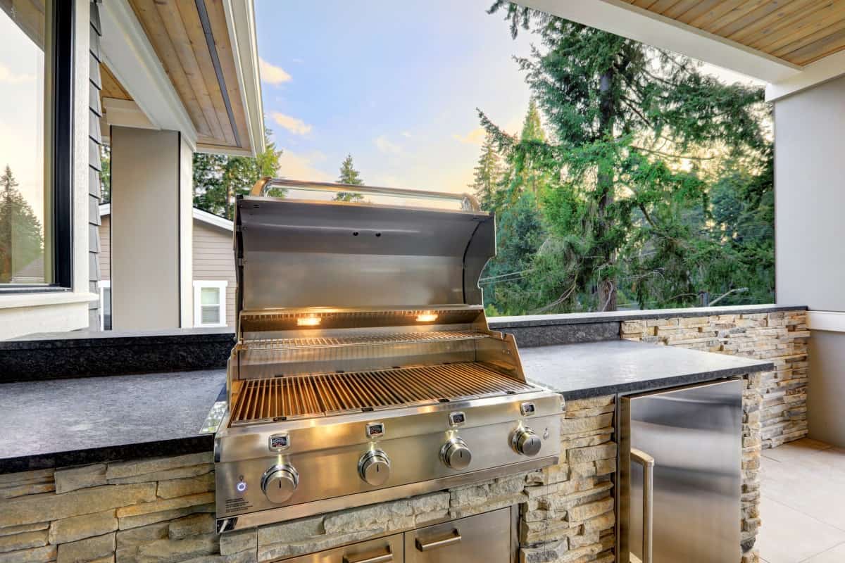 A built-in gas grill as part of an outdoor kitc.