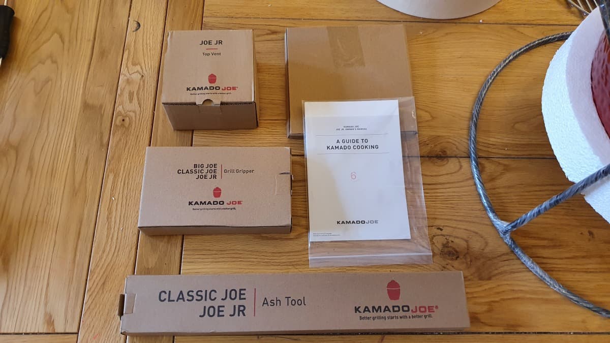 joe jr accessory boxes arranged on an oak table