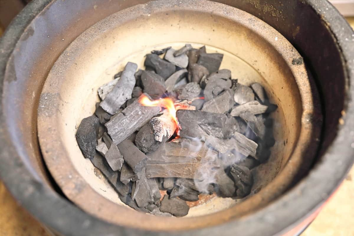 charcoal on fire inside a Kamado Joe .