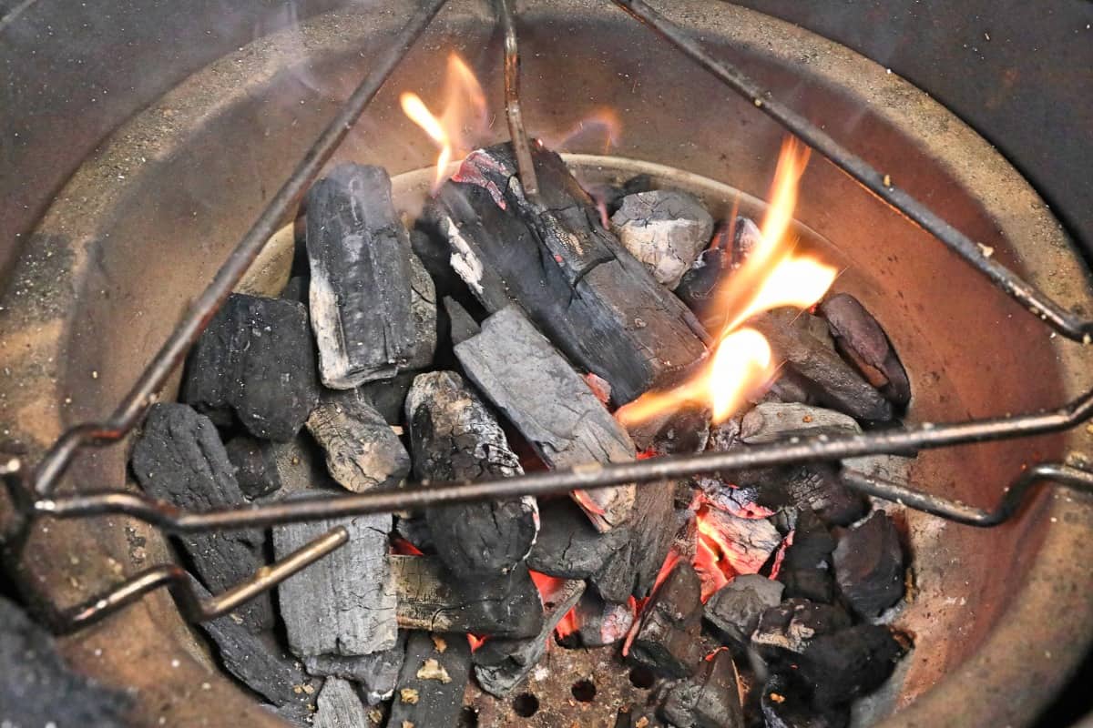 Burning charcoal in a Kamado Joe Jr fire.