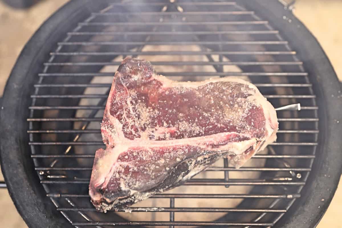 Porterhouse steak on Joe Jr. grates, with a Meater probe inser.