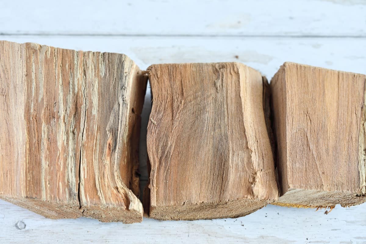 Three apple wood chunks, showing some differences in grain.