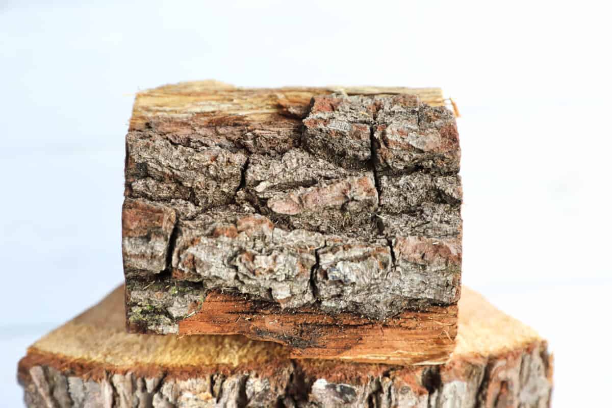 A close up of the bark on an oak smoking wood chunk.