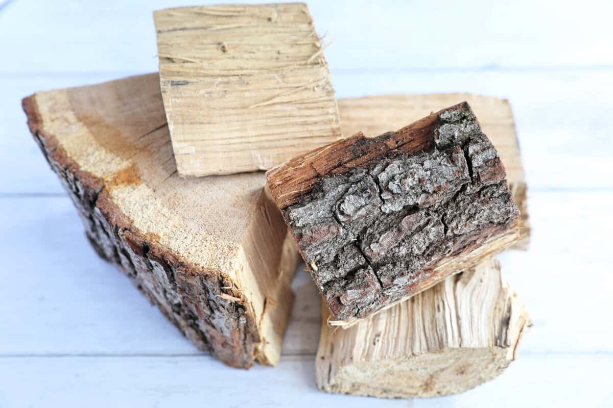 A small pile of oak chunks on a white surface.