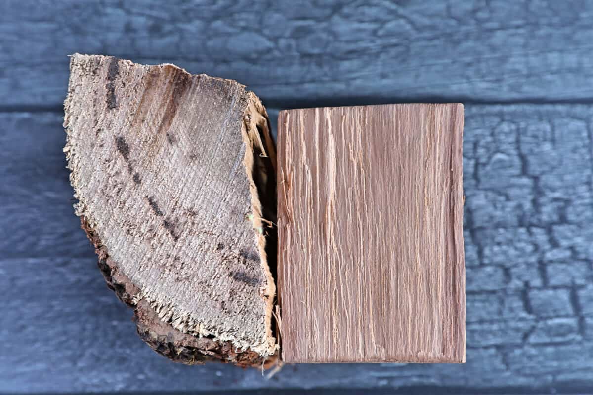 Two chunks of pecan wood, arranged to show us the grain of the wood from different angles.