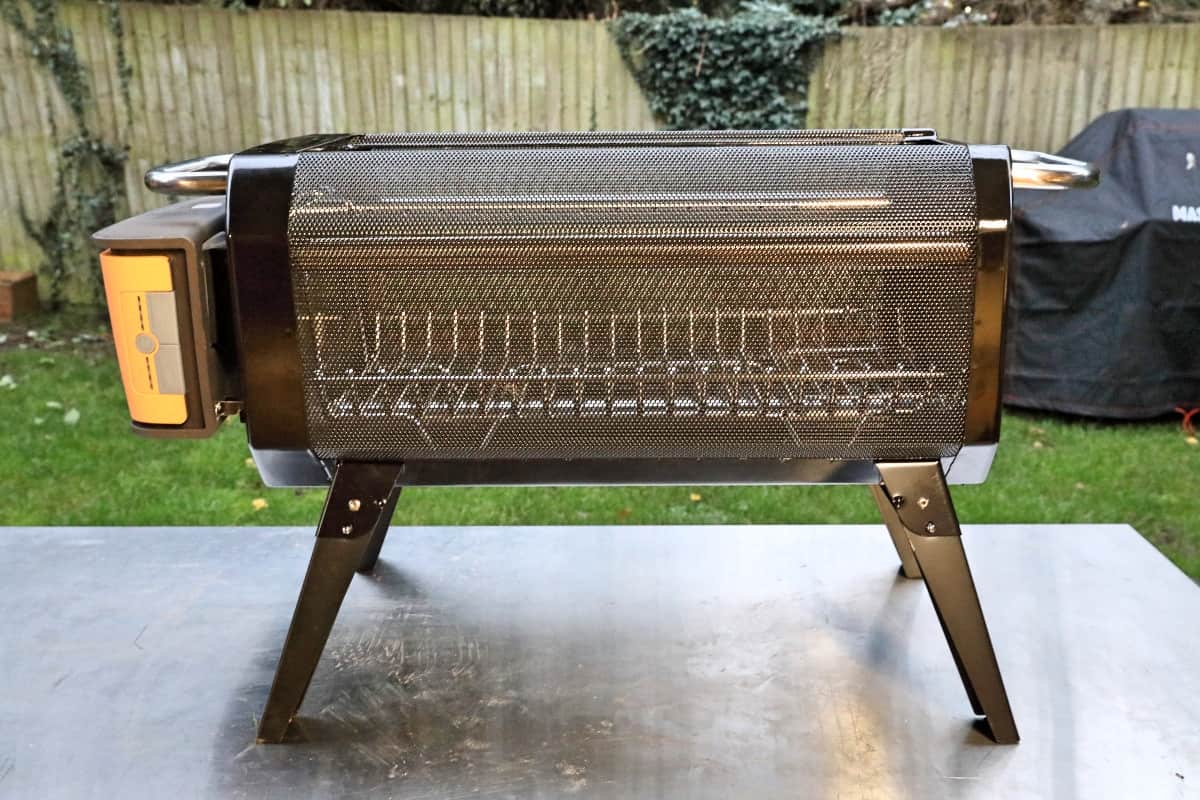 Side view of the Biolite FirePit+ sitting on a stainless steel table