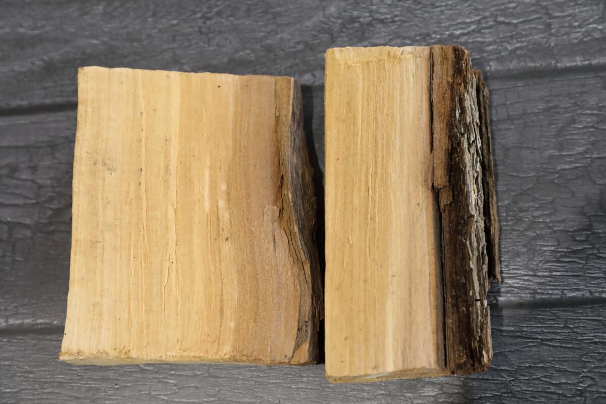 Close up of two small chunks of pear wood so you can see the grain of the wood.