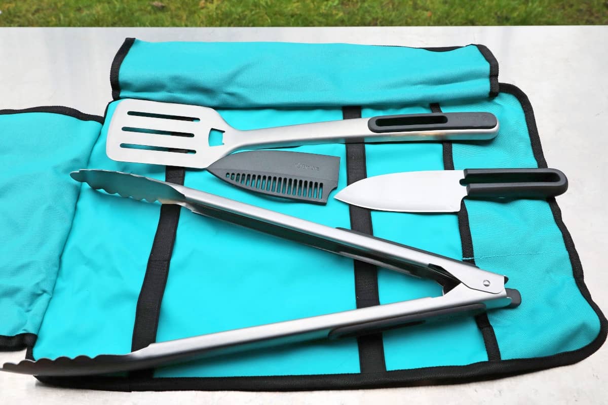 The BioLite prep and grill toolkit, opened up to show the spatula, tongs, and kni.