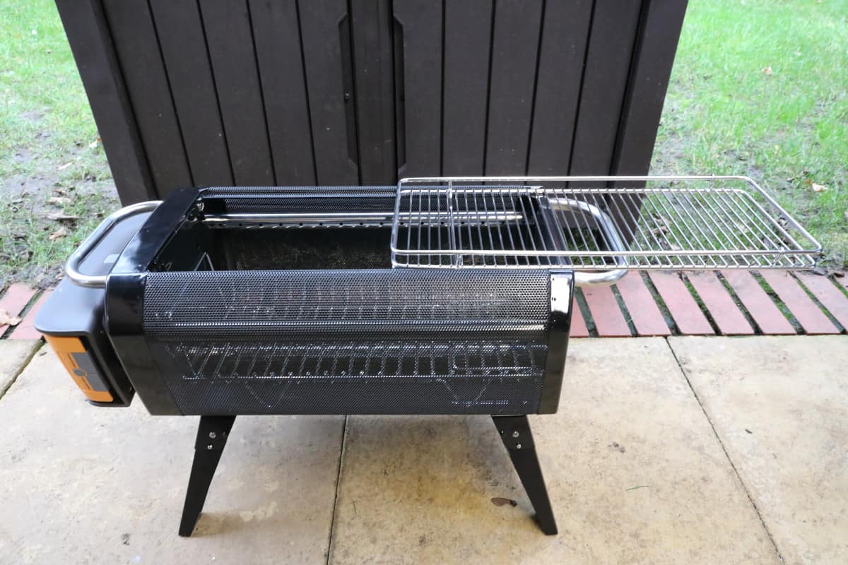 The BioLite FirePit+ with the cooking grate slid out from the side