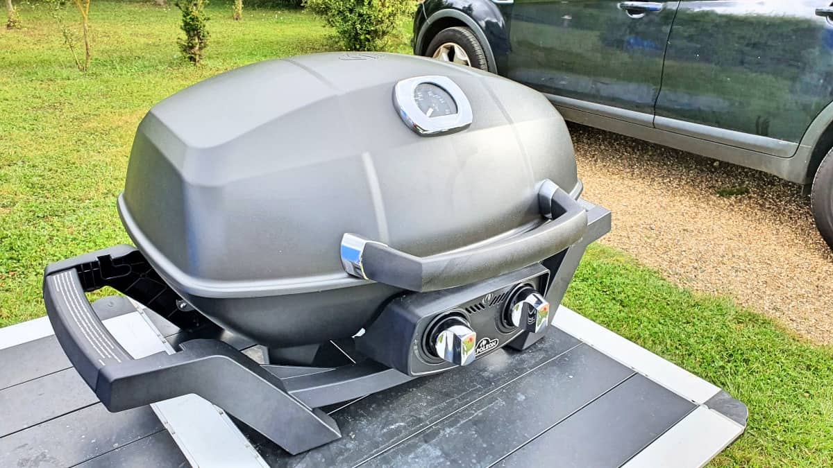 Napoleon Pro 285 travel gas grill photographed from a slight an.