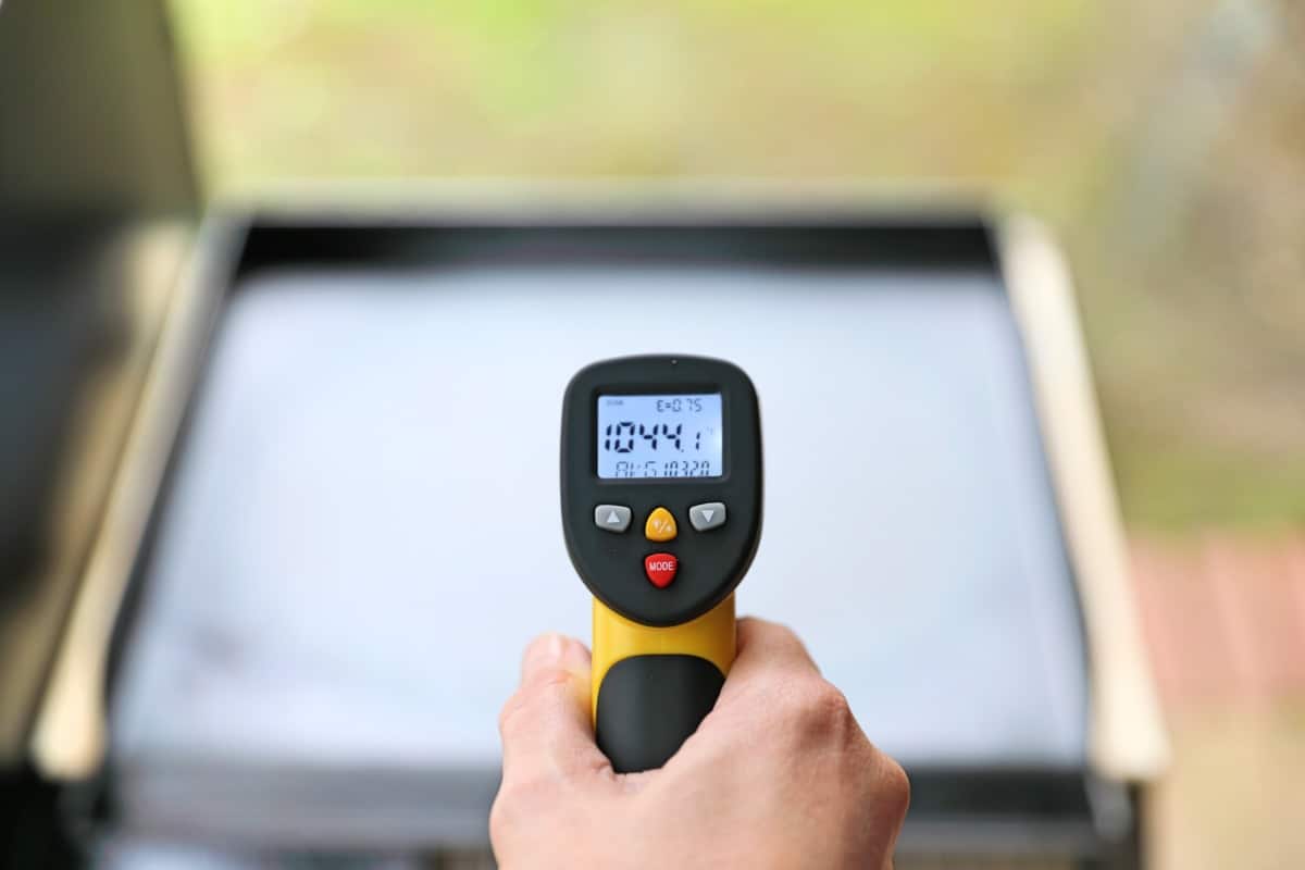 An IR thermometer showing a surface temperature of 1041 degrees F on a griddle