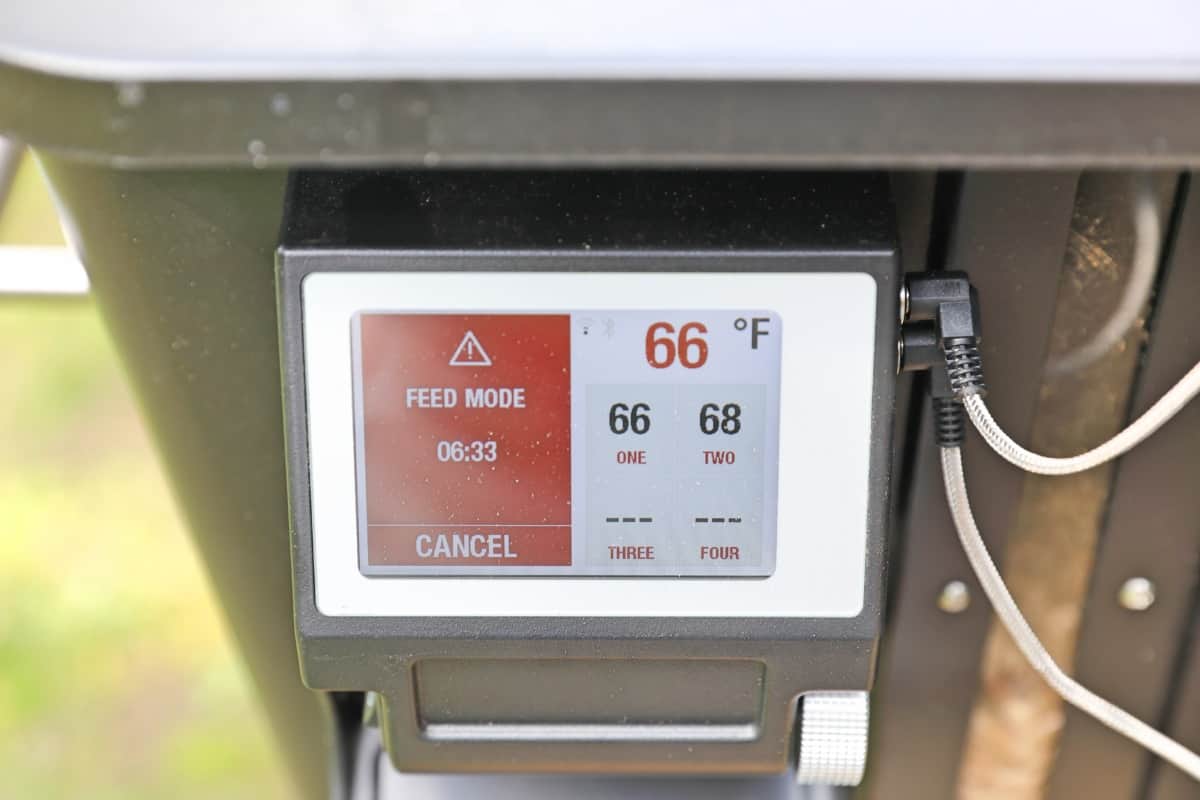 Photo of Camp Chef Woodwind Wi-Fi 36 controller and LCD showing 'feed' sett.