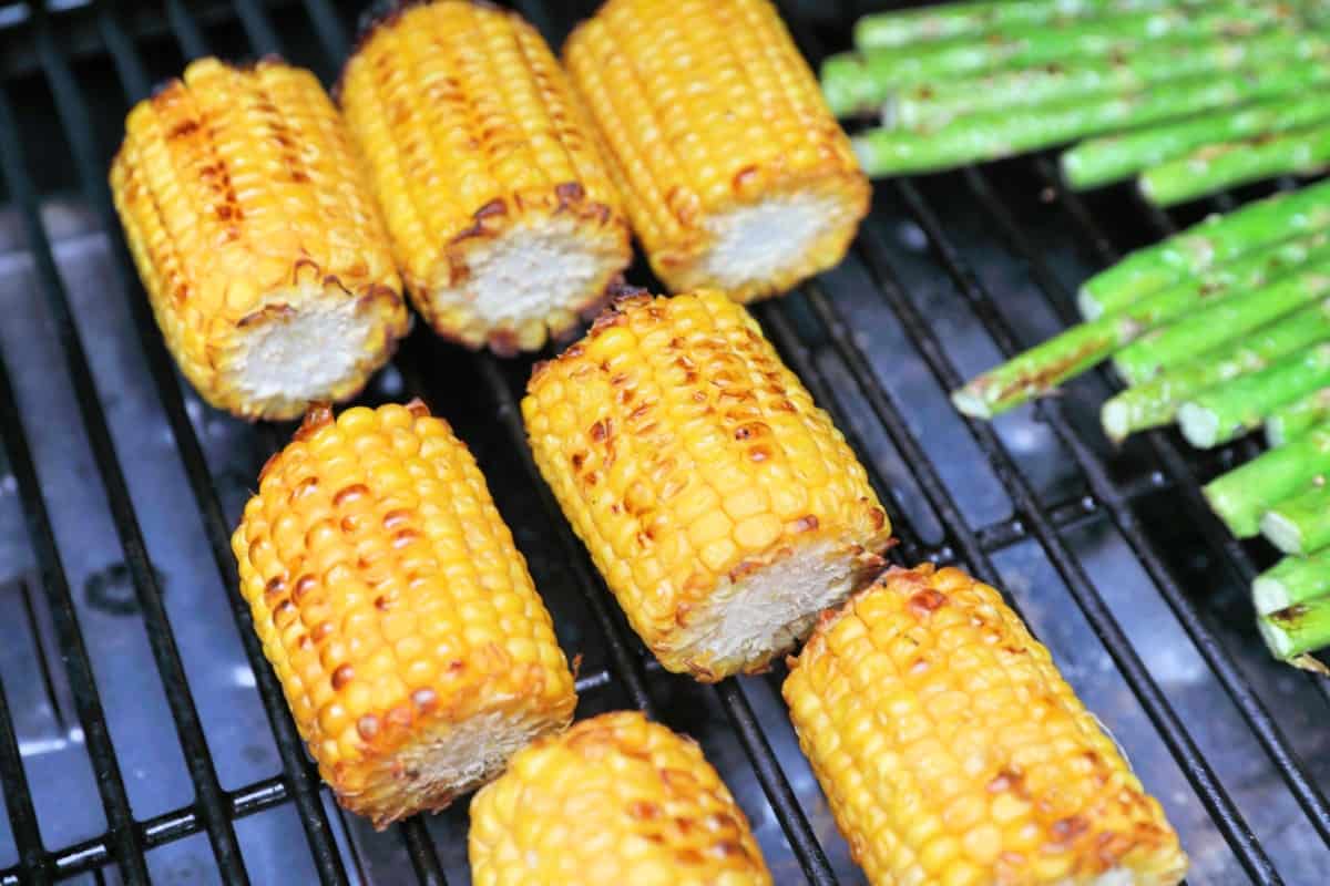 Close up of corn grilling in the main chamber of a Camp Chef Woodwind Wi-Fi 36.