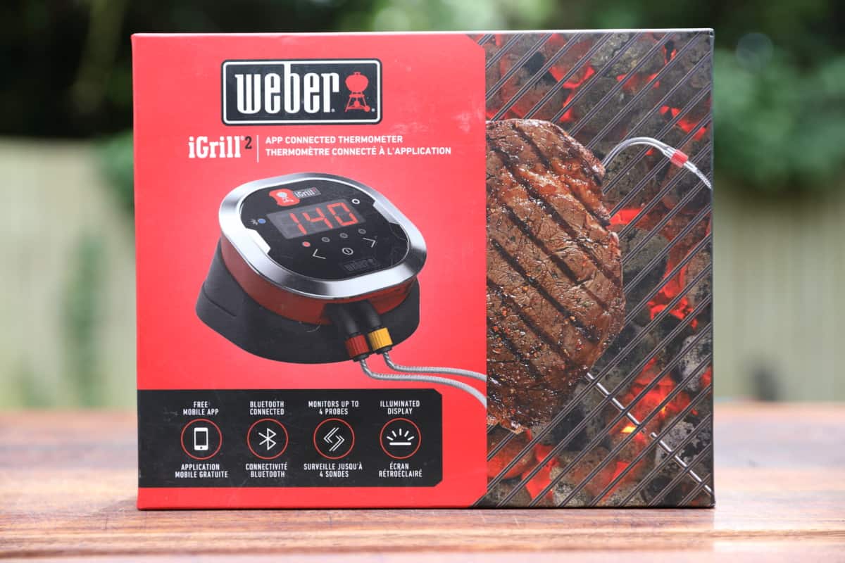 Weber iGrill 2 box on a wooden cutting board