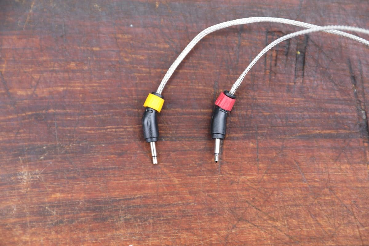 Close up of two Weber iGrill 2 probe plugs, with identifying red and yellow bands.