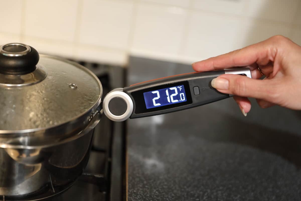 ChefsTemp FinalTouch X10 taking the temperature of boiling water, displaying 212 degrees Fahrenh.