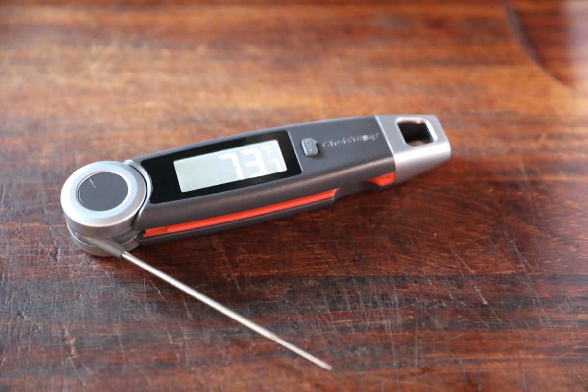 Angled shot of the ChefsTemp FinalTouch X10 instant read thermometer on a cutting board.