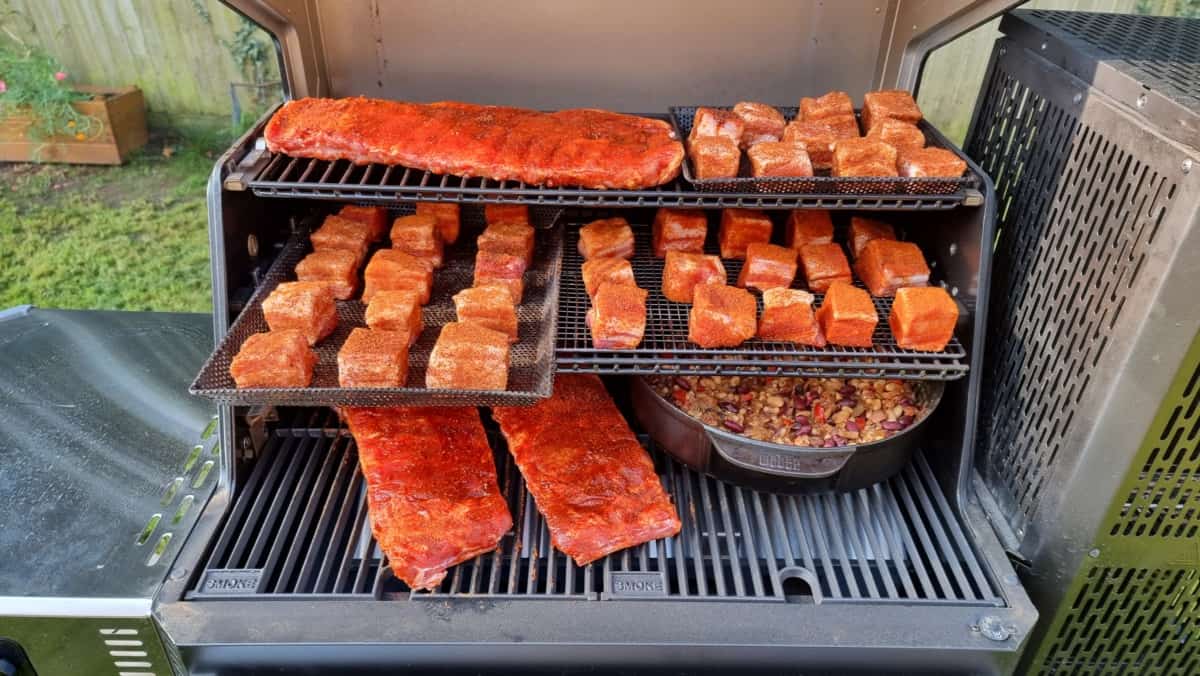 Masterbuilt gravity series filled with pork belly burnt ends, ribs, and pit be.