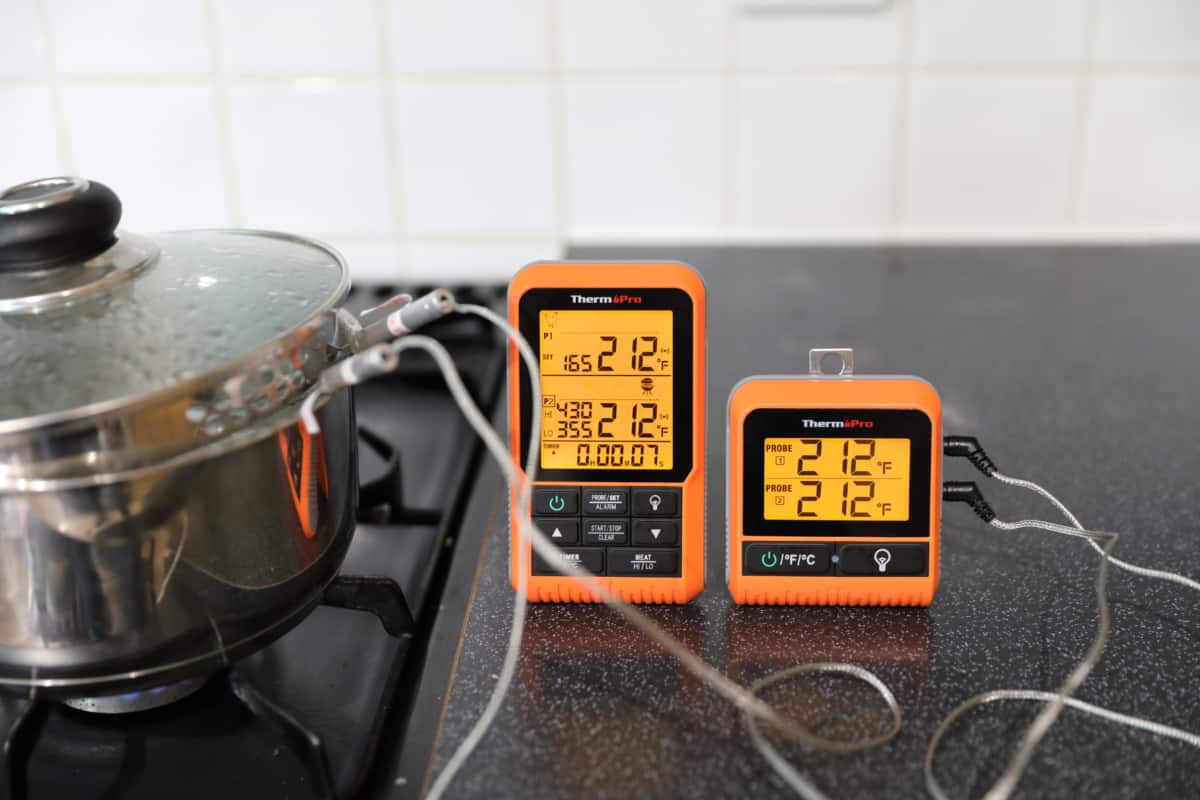 ThermoPro TP826 measuring  boiling water, showing 212 degrees Fahrenheit for both pro.