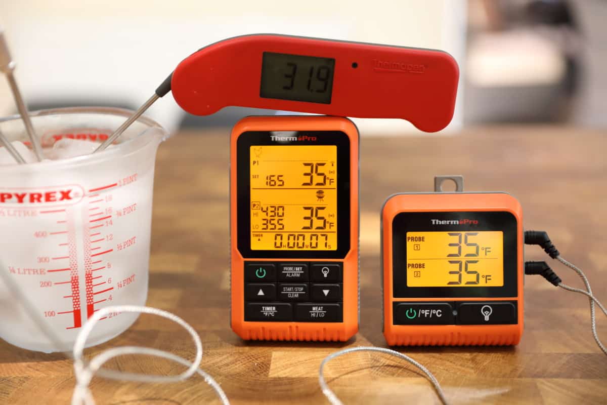 ThermoPro TP826 measuring ice water, and reading 35 degrees Fahrenheit for both probes, with a Thermapen One showing 31.9 degr.